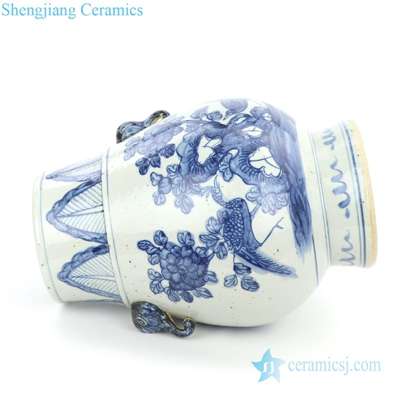 blue and white ceramic with two handles jar